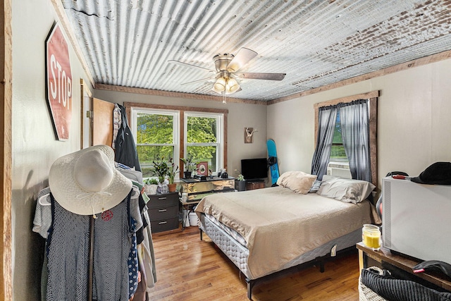 7694 Norconk Rd, Bear Lake, MI 49614 - bedroom featuring light wood-style flooring and ceiling fan