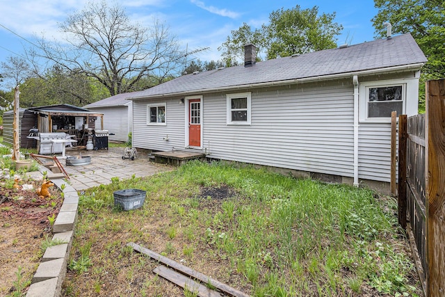 7694 Norconk Rd, Bear Lake, MI 49614 - rear view of property featuring a patio, a gazebo, and roof with shingles