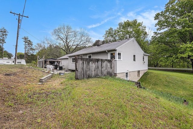 7694 Norconk Rd, Bear Lake, MI 49614 - view of property exterior featuring a lawn