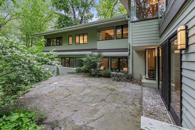 202 Orchard Hills Dr, Ann Arbor, MI 48104 - rear view of property with a patio area