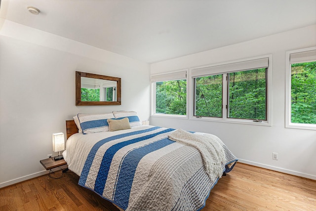 202 Orchard Hills Dr, Ann Arbor, MI 48104 - bedroom featuring baseboards and wood finished floors