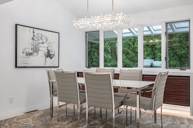 202 Orchard Hills Dr, Ann Arbor, MI 48104 - dining area with a chandelier, baseboards, and lofted ceiling