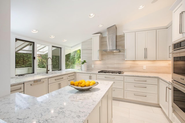 202 Orchard Hills Dr, Ann Arbor, MI 48104 - kitchen with a sink, wall chimney exhaust hood, backsplash, white cabinetry, and light tile patterned floors