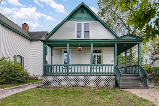 1508 Mckinley St, Bay City, MI 48708 - view of front of property featuring a porch and a front lawn