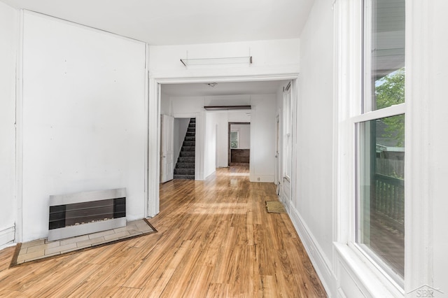 1508 Mckinley St, Bay City, MI 48708 - corridor with light wood-style flooring, stairs, and heating unit