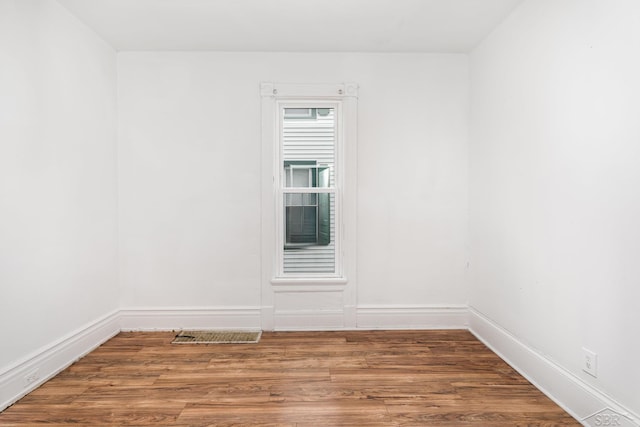1508 Mckinley St, Bay City, MI 48708 - empty room featuring wood finished floors and baseboards
