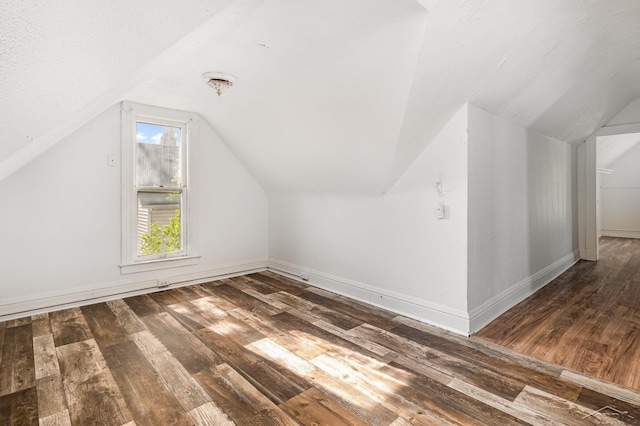 1508 Mckinley St, Bay City, MI 48708 - bonus room with hardwood / wood-style floors, lofted ceiling, and baseboards