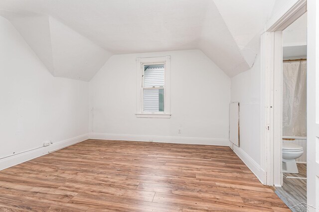 1508 Mckinley St, Bay City, MI 48708 - bonus room with vaulted ceiling, light wood finished floors, and baseboards