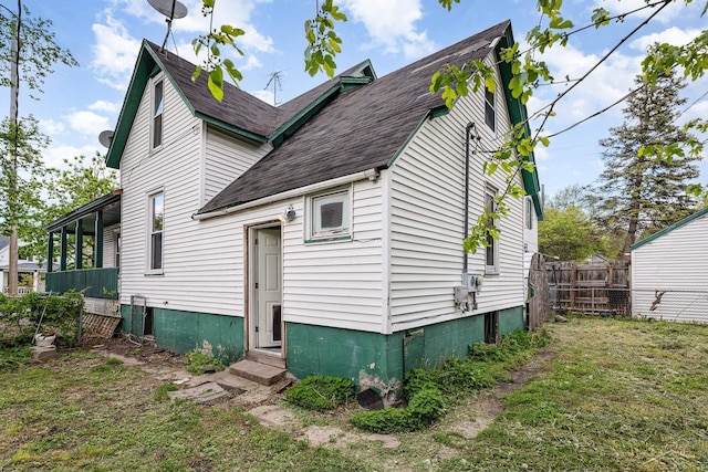 1508 Mckinley St, Bay City, MI 48708 - rear view of property featuring entry steps and roof with shingles