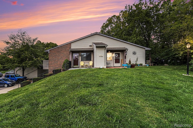313 Spring Brooke Dr, Brighton, MI 48116 - view of front facade with a front yard and brick siding