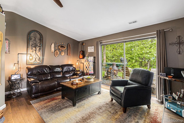 313 Spring Brooke Dr, Brighton, MI 48116 - living room featuring wood-type flooring, vaulted ceiling, baseboards, and a ceiling fan