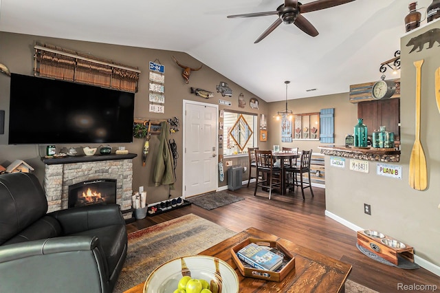 313 Spring Brooke Dr, Brighton, MI 48116 - living area with ceiling fan, vaulted ceiling, dark wood-type flooring, baseboards, and a fireplace