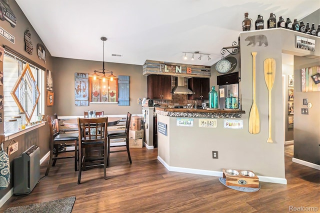 313 Spring Brooke Dr, Brighton, MI 48116 - kitchen featuring wall chimney exhaust hood, dark wood finished floors, backsplash, baseboards, and dark brown cabinets