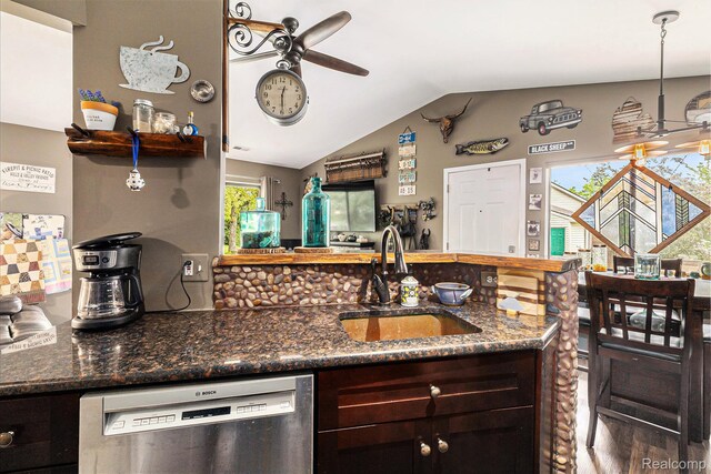 313 Spring Brooke Dr, Brighton, MI 48116 - kitchen featuring dishwasher, a sink, ceiling fan, lofted ceiling, and dark stone countertops