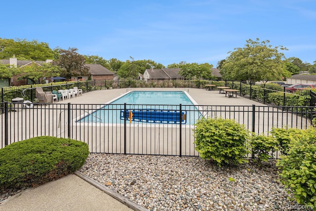 313 Spring Brooke Dr, Brighton, MI 48116 - community pool featuring a patio area