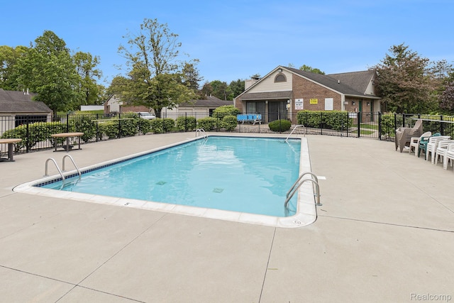 313 Spring Brooke Dr, Brighton, MI 48116 - community pool with a patio area