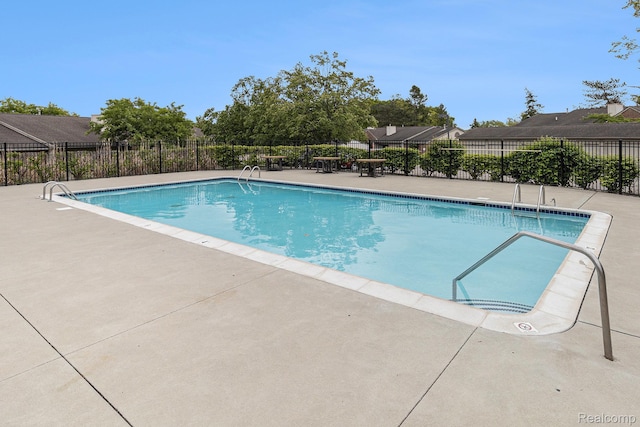 313 Spring Brooke Dr, Brighton, MI 48116 - community pool with a patio area
