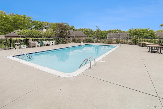 313 Spring Brooke Dr, Brighton, MI 48116 - community pool with a patio area
