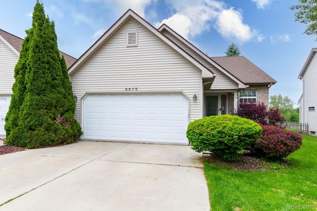 6075 Davison Rd, Burton, MI 48509 - view of front of house featuring driveway, an attached garage, roof with shingles, brick siding, and a front yard
