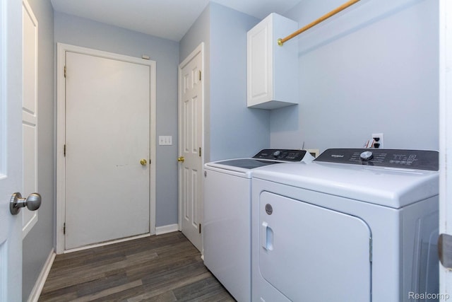 6075 Davison Rd, Burton, MI 48509 - laundry area with washer and clothes dryer, cabinet space, baseboards, and dark wood finished floors