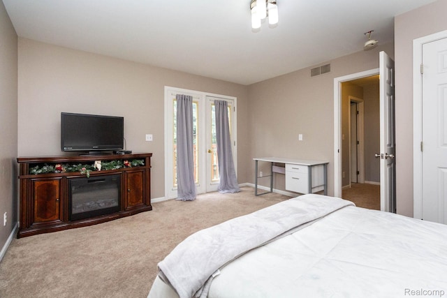6075 Davison Rd, Burton, MI 48509 - bedroom featuring access to outside, carpet flooring, and baseboards