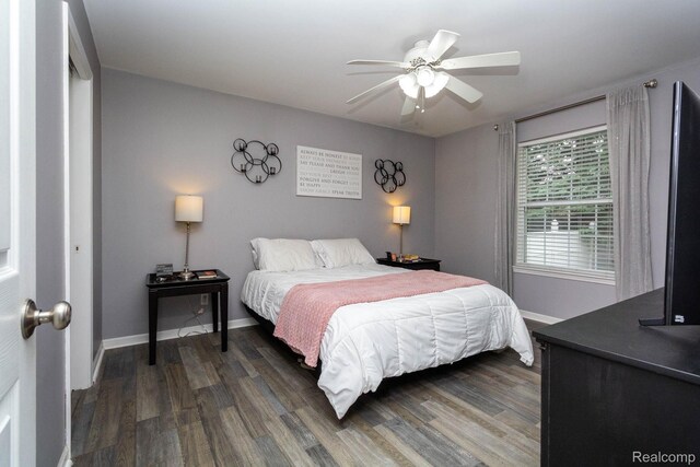 6075 Davison Rd, Burton, MI 48509 - bedroom with wood finished floors, baseboards, and a ceiling fan