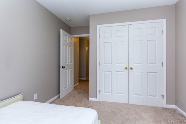 6075 Davison Rd, Burton, MI 48509 - carpeted bedroom with a closet and baseboards