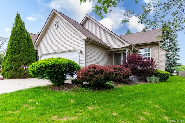 6075 Davison Rd, Burton, MI 48509 - view of side of property with an attached garage, a yard, and a shingled roof