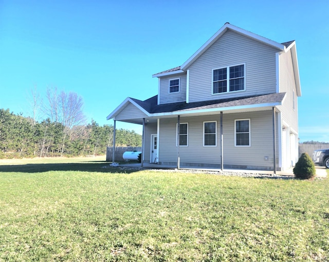 6039 W Morris Lake Rd, Mears, MI 49436 - view of front of house with a front lawn and a porch