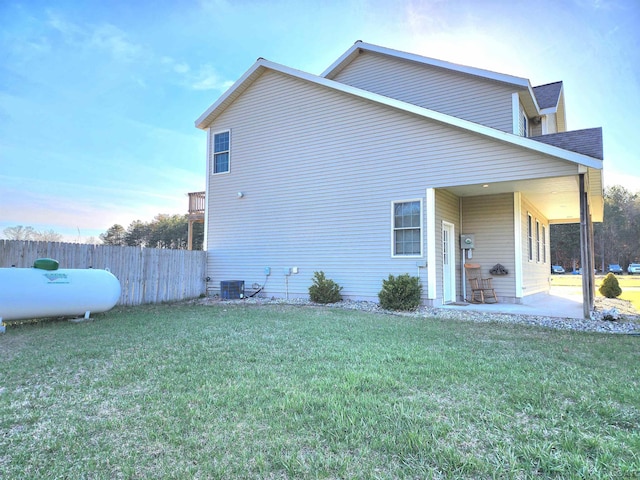 6039 W Morris Lake Rd, Mears, MI 49436 - view of side of property with a patio area and central AC unit