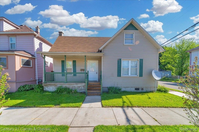 59 E Pleasant St, River Rouge, MI 48218 - view of front facade featuring covered porch, a front yard, and crawl space