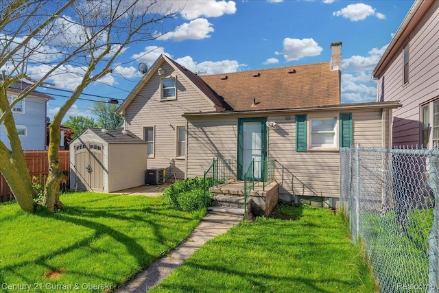 59 E Pleasant St, River Rouge, MI 48218 - rear view of house with central AC and a chimney