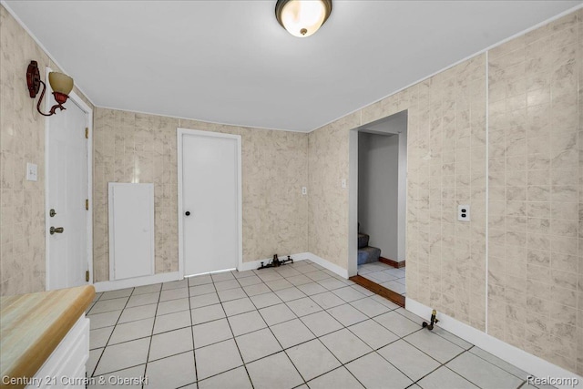 59 E Pleasant St, River Rouge, MI 48218 - spare room with light tile patterned floors, baseboards, and stairs