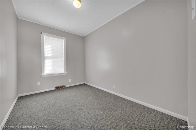 59 E Pleasant St, River Rouge, MI 48218 - carpeted empty room with baseboards and lofted ceiling
