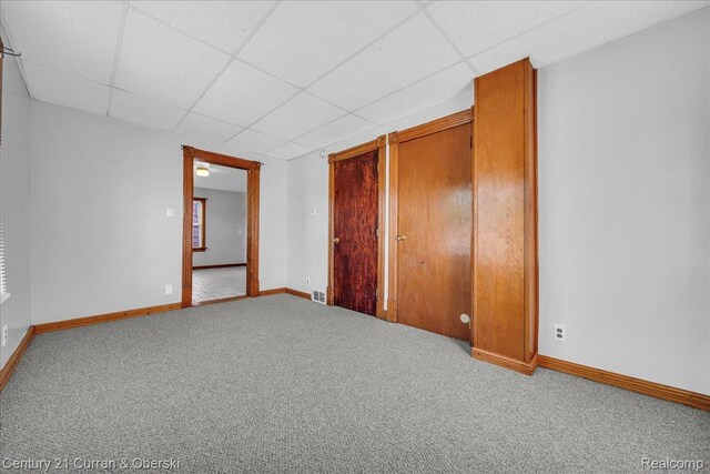 59 E Pleasant St, River Rouge, MI 48218 - unfurnished bedroom with a paneled ceiling, carpet, and baseboards