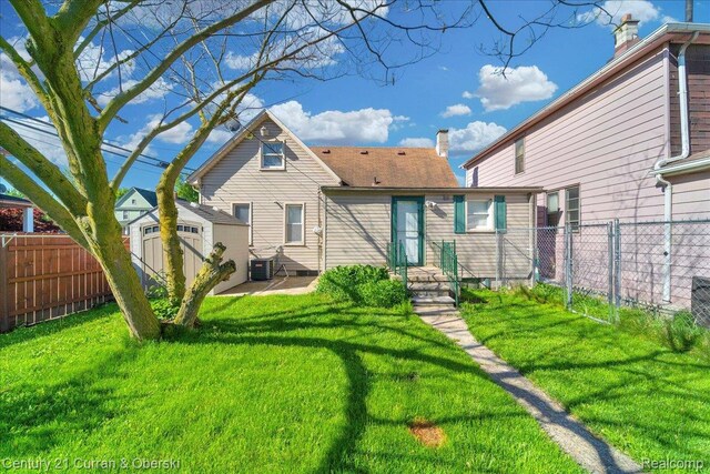 59 E Pleasant St, River Rouge, MI 48218 - back of property featuring cooling unit and a patio