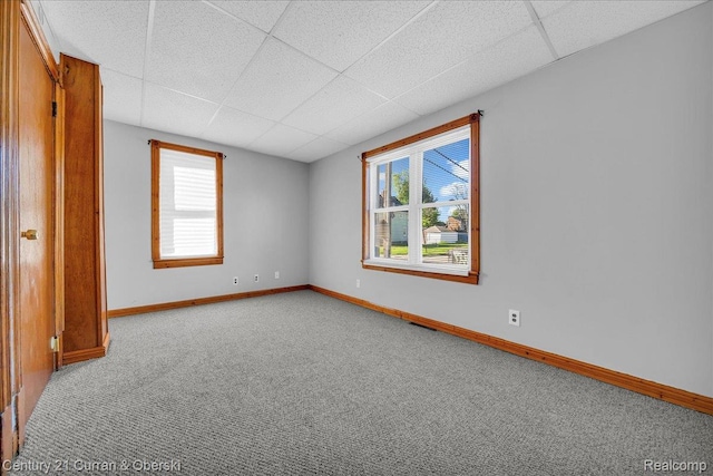 59 E Pleasant St, River Rouge, MI 48218 - spare room with a paneled ceiling, carpet, and baseboards