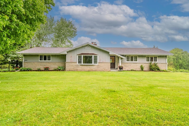 2800 Mayflower Rd, Niles, MI 49120 - single story home featuring a front lawn, stone siding, a shingled roof, and a chimney
