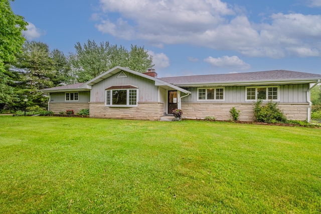 2800 Mayflower Rd, Niles, MI 49120 - ranch-style house featuring stone siding, a chimney, and a front yard