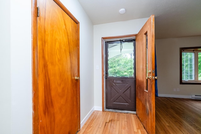 2800 Mayflower Rd, Niles, MI 49120 - entryway featuring light wood-type flooring, baseboards, and a baseboard radiator