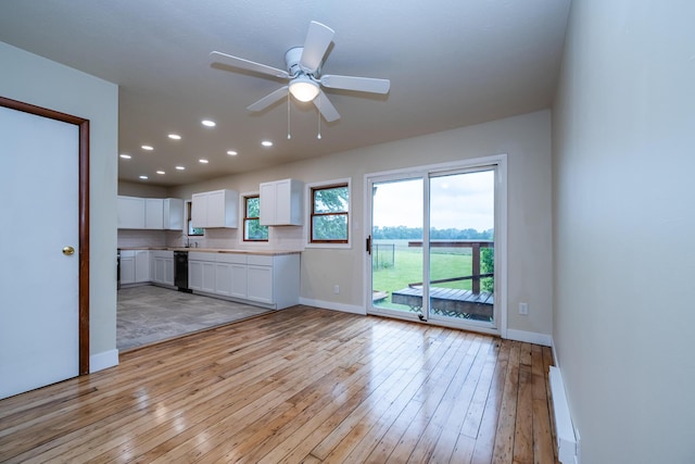 2800 Mayflower Rd, Niles, MI 49120 - unfurnished living room featuring light wood finished floors, baseboards, a baseboard radiator, ceiling fan, and recessed lighting