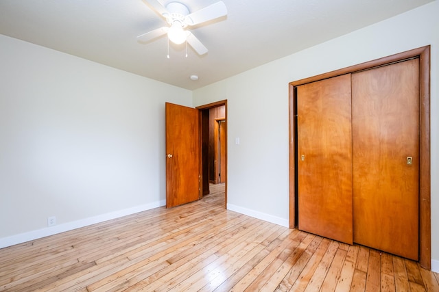 2800 Mayflower Rd, Niles, MI 49120 - unfurnished bedroom with light wood finished floors, baseboards, a closet, and a ceiling fan