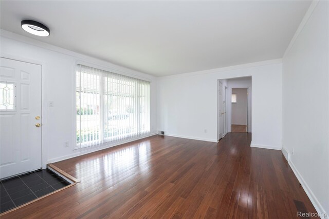 26211 Linwood St, Roseville, MI 48066 - unfurnished living room with wood finished floors, baseboards, and ornamental molding