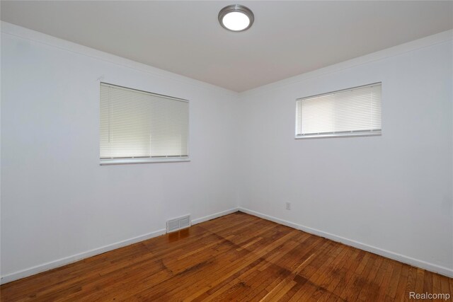 26211 Linwood St, Roseville, MI 48066 - unfurnished room featuring hardwood / wood-style flooring, baseboards, and ornamental molding