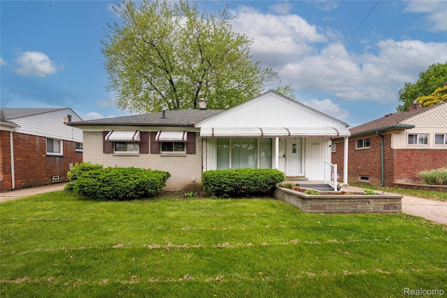 26211 Linwood St, Roseville, MI 48066 - bungalow-style home with a front yard and brick siding