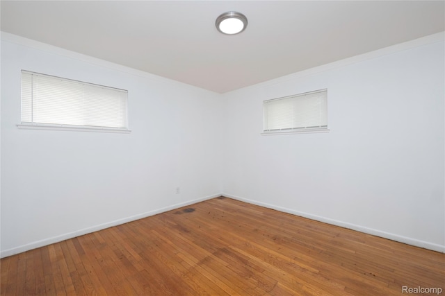 26211 Linwood St, Roseville, MI 48066 - unfurnished room featuring baseboards, hardwood / wood-style flooring, and crown molding