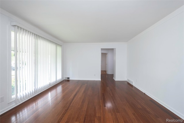 26211 Linwood St, Roseville, MI 48066 - unfurnished room with dark wood-type flooring, baseboards, and ornamental molding
