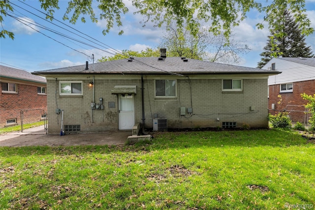 26211 Linwood St, Roseville, MI 48066 - back of property featuring central AC unit, a patio, brick siding, and a gate