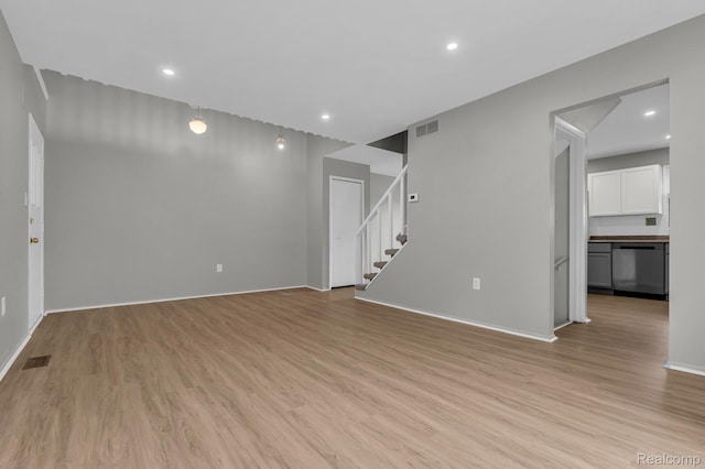 5025 Crooks Rd Unit 42, Royal Oak, MI 48073 - unfurnished room featuring light wood-style flooring, baseboards, stairs, and recessed lighting