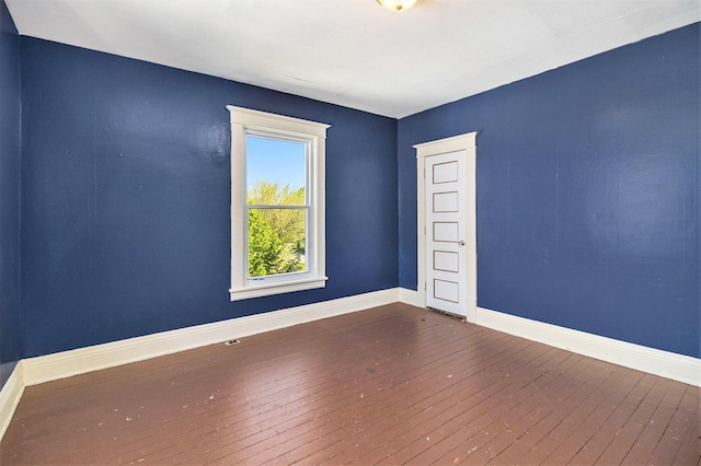115 N Emily, Ludington, MI 49431 - spare room with hardwood / wood-style flooring and baseboards